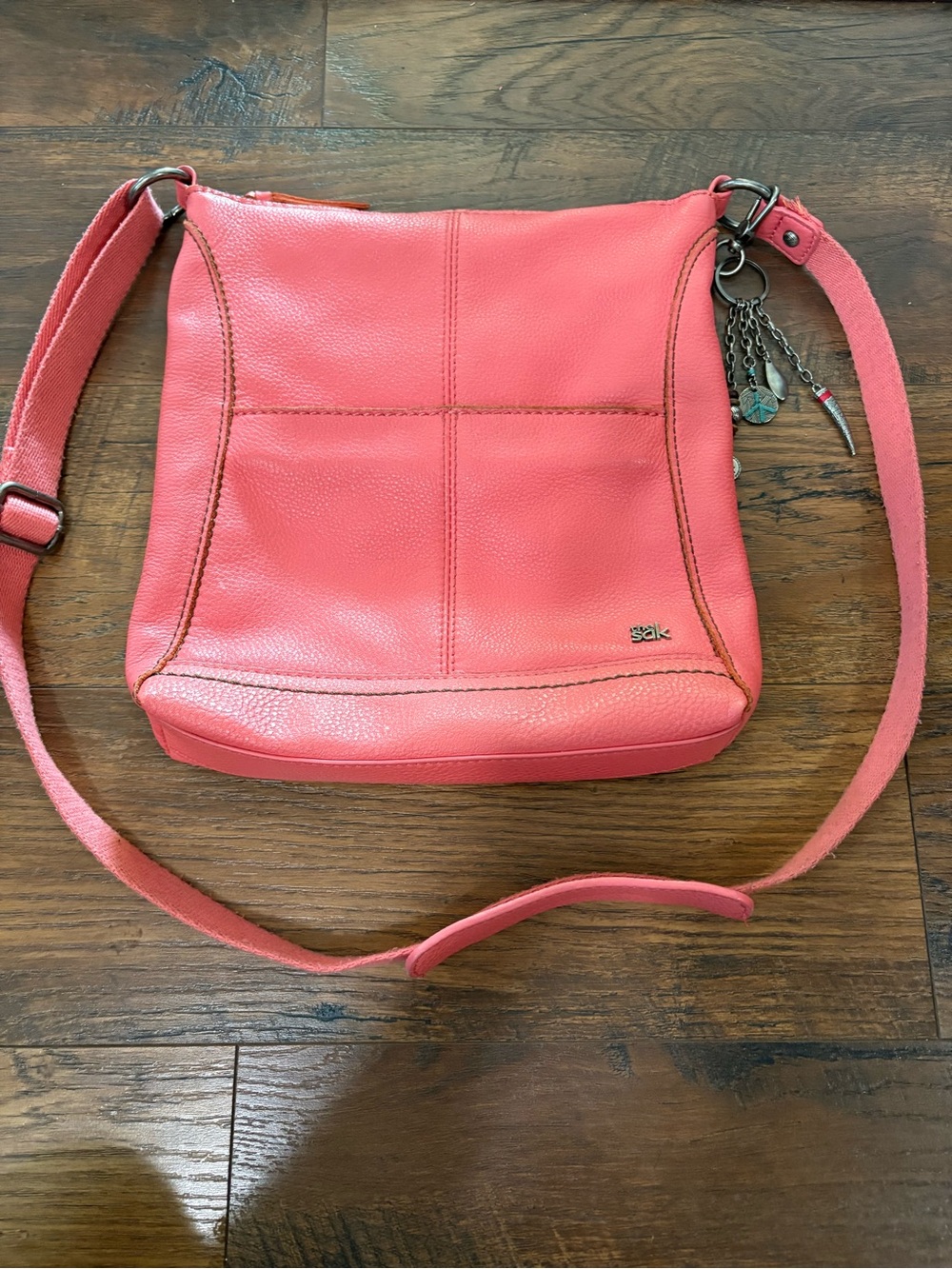 The Sak Coral Pink Leather Crossbody with Charm Detail
